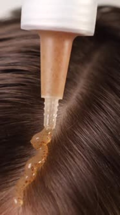 Applying Scalp Scrub Closeup Hair Care