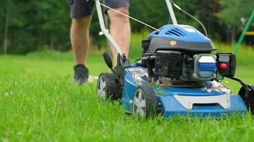 Lawn Mower Cutting Grass Small Grass Cuttings Fly Out of Lawnmower Grass Clippings Get Spewed Out of