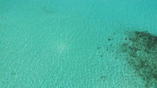 Turquoise Ocean Aerial. Transparent Ocean Floor. Maldives