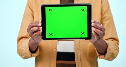 Tablet mockup, green screen display and hands in studio with website, internet and social network