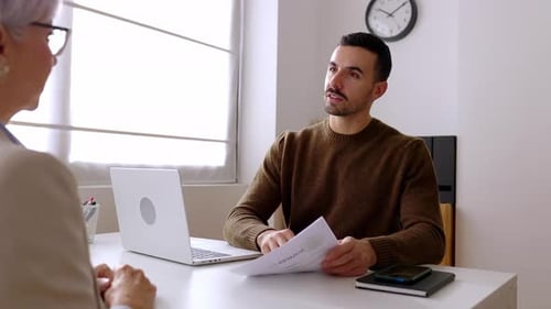 Human Resources Manager Doing a Job Interview to Senior Woman Candidate