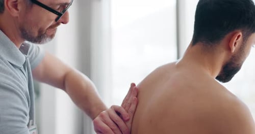 Physiotherapist, massage or man in physiotherapy rehabilitation for body or healing back pain