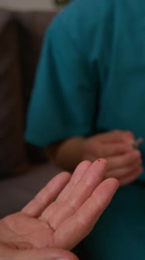 Woman Using Lancing Device, Nurse Collecting Blood for At-home Glucose Testing