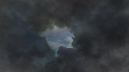 point of view thick clouds in the blue sky and lightning bolts in them.