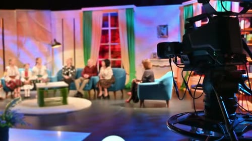 Professional television camera shooting a talk show in a studio. Video production backstage