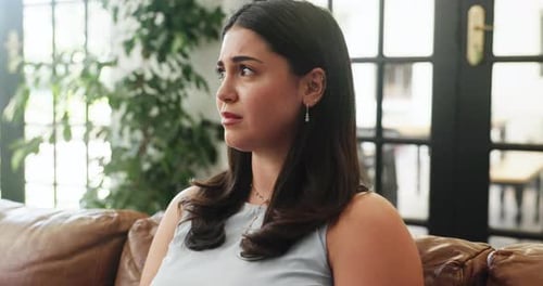 Home, crying and sad woman on sofa, mental health and depression with loss, grief and thinking