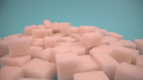 Sugar cubes close up on isolated 4K
