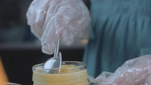 The Chef Grinds Dill in the Mayonnaise Sauce with Mustard Slider and Macro Shooting