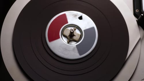 Spinning Reel to Reel Audio Tape in Professional Magnetophone, Close Up