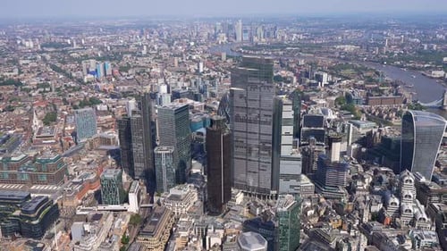 Aerial view of the City of London with Canary Wharf in the background, River Thames and the Shard. L