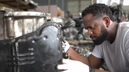 Men repairing car engine in auto repair shop, Selective focus.