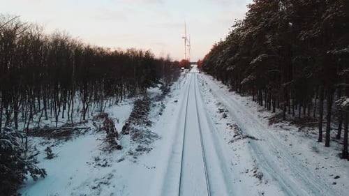 Drone flying and following train tracks.