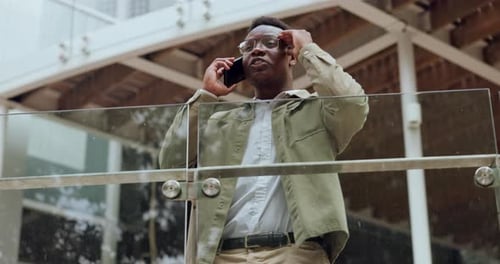 Phone call, stress and black businessman in city on a balcony frustrated by phishing