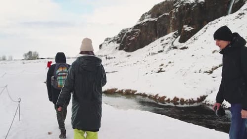 Our Traveler Friends Walking on a Snow Canyon in Iceland Slow Motion
