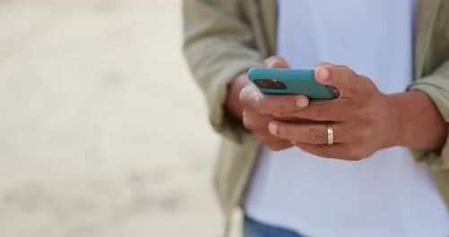 Hands typing on phone, man on beach and communication with technology on holiday travel