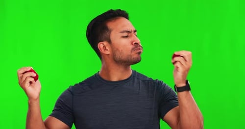 Strong, health and man with apple on green screen for healthy diet, nutrition and weight loss