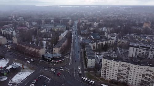 Soviet buildings in Latvia, city of Riga, aerial drone, backwards, snowfall