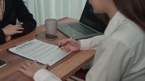 Enthusiastic Client Hand Putting Signature on Official Document