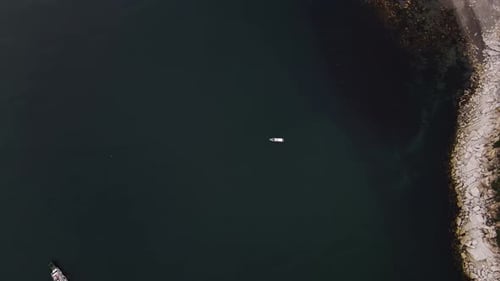Aerial View of a Small Boat in the Middle of the Sea