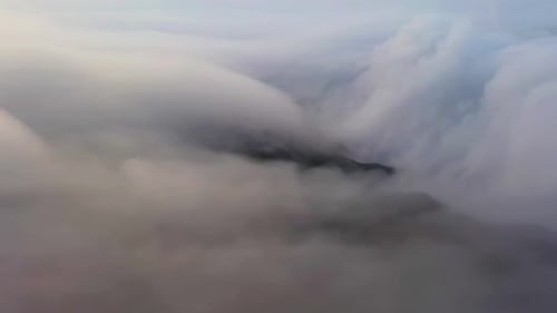 Massive clouds moving around mountain peak Tai Mo Shan, Hong Kong