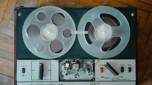 The Girl Turns on the Old Tape Recorder and Playback is in Progress