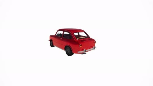 Classic red vintage car evokes nostalgia for simpler times on a clean white background