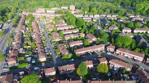 4K aerial shot of typical British houses from above in the morning and housing crisis
