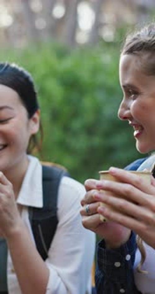 Hiking, friends and women in nature with coffee for outdoor adventure, trekking and fresh air