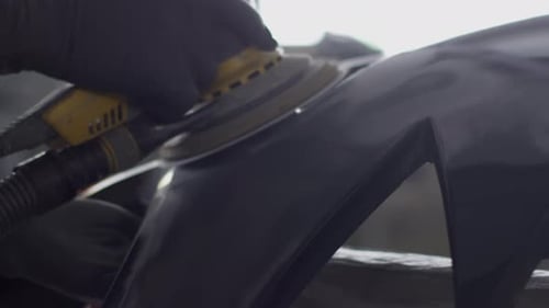 Mechanic Works with a Grinding Tool