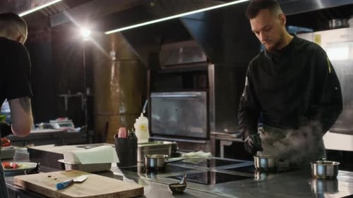 Close Up Man Cutting Salmon Sushi Roll Vertical