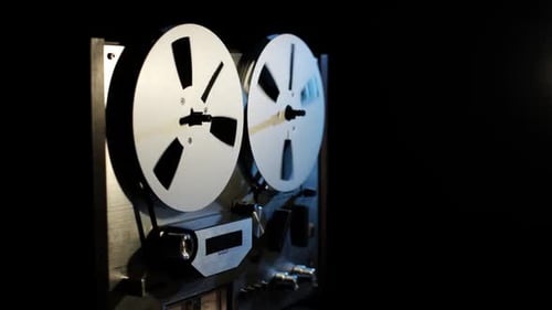 Vintage Reel Tape Deck Starts Playback Dark Background