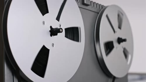 Vintage ReeltoReel Tape Deck Playing Audio