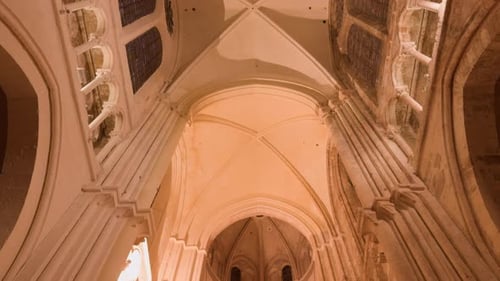 Tilt down view of painted ceiling of Church with vintage old architecture in Blois, France. No peopl
