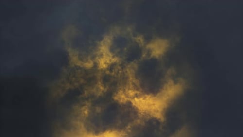 Lightning flashes through dark storm clouds. Black clouds before the thunderstorm