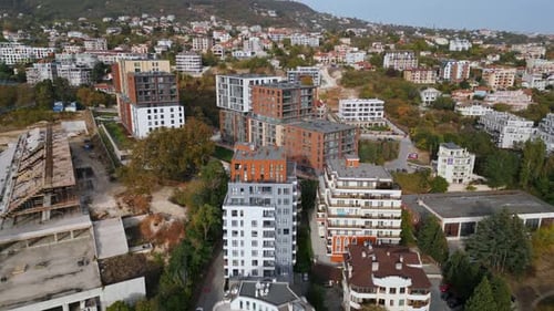 Aerial View of a Drone Flying Around and Along the Facade of a Modern Residential Building