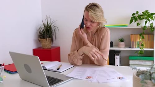 Female HR Recruiter Talking with Job Applicant By Phone Call in the Office