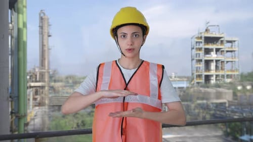 Indian female construction worker talking
