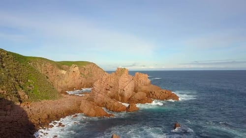 Aerial shot of beautiful mountains near a beach in Australia