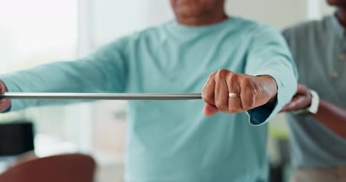 Resistance band, hands and senior man at physiotherapy for consultation with muscle recovery