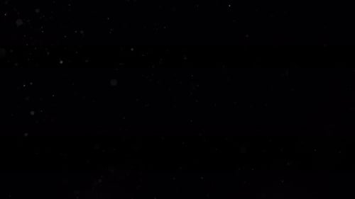 Dust Particles Flying In The Air Isolated On Black Background