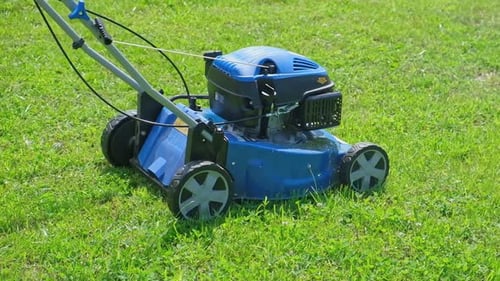 Lawn Mower Cutting Grass Small Grass Cuttings Fly Out of Lawnmower Grass Clippings Get Spewed Out of