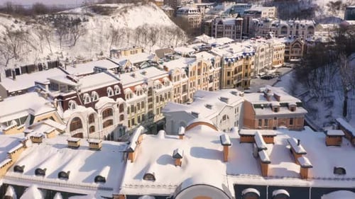 Aerial Panoramic View of Rooftops of Modern Residential Buildings Covered with Snow