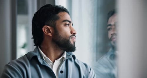 Sad, thinking and business man by window with stress for failure, job loss and bankruptcy