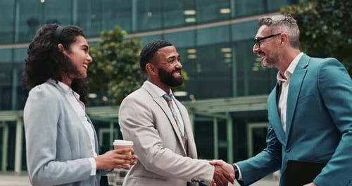 Handshake, collaboration and business people in city for teamwork, agreement or partnership meeting