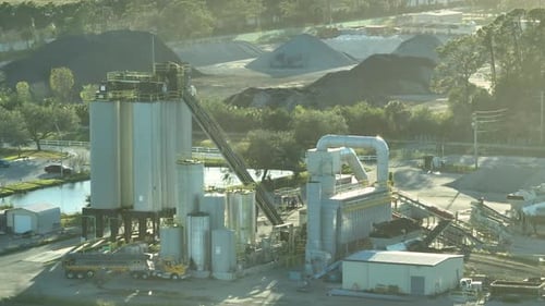 Concrete Manufactory at Cement Mixing Factory Industrial Area with Cargo Trucks and Heavy Building