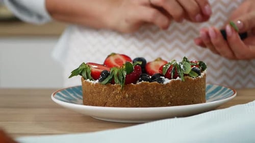 The Cook Makes a Cake and Puts Strawberries with Blueberries on the Preparation Preparation of