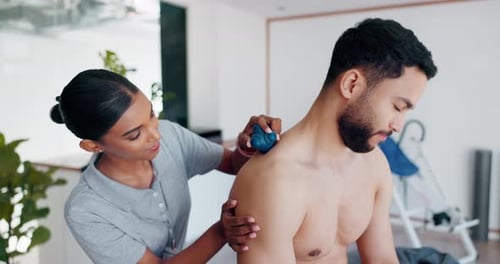 Ball, massage or man in physiotherapy to relax the body or shoulders for healing back pain