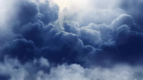 thick cumulus clouds in the sky with a thunderstorm