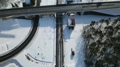 Bird's Eye View Of Roads And Railways In Countryside Landscape During Winter In Rakowice, Krakow, Po