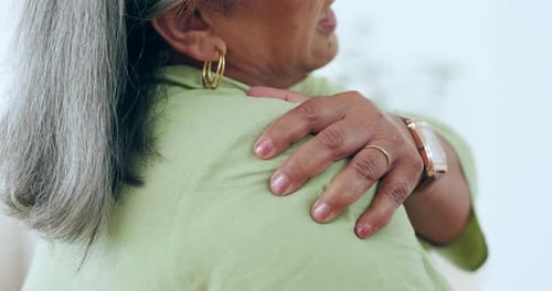 Senior, woman or massage shoulder for pain, injury or orthopedic wound at home